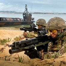 Two commandos aiming under-slung greande launchers onn a beach