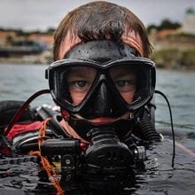 Close up of a Navy diver wearing his mask