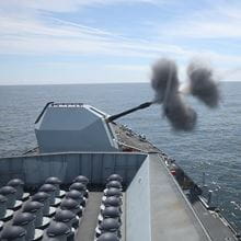A missile is being fired from a ship