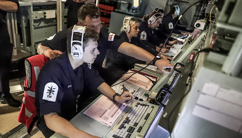 Ships company of HMS Albion in the Ops Room as they run through an air defence exercise (ADEX) with the French maritime forces.