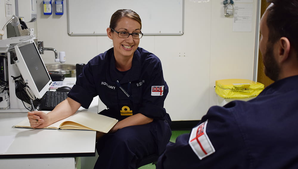 Medical Navy personnel smiles. Medical specialists onboard include dental, biomedical scientists, radiographers, surgeons, nursing staff and the RM Band service. 