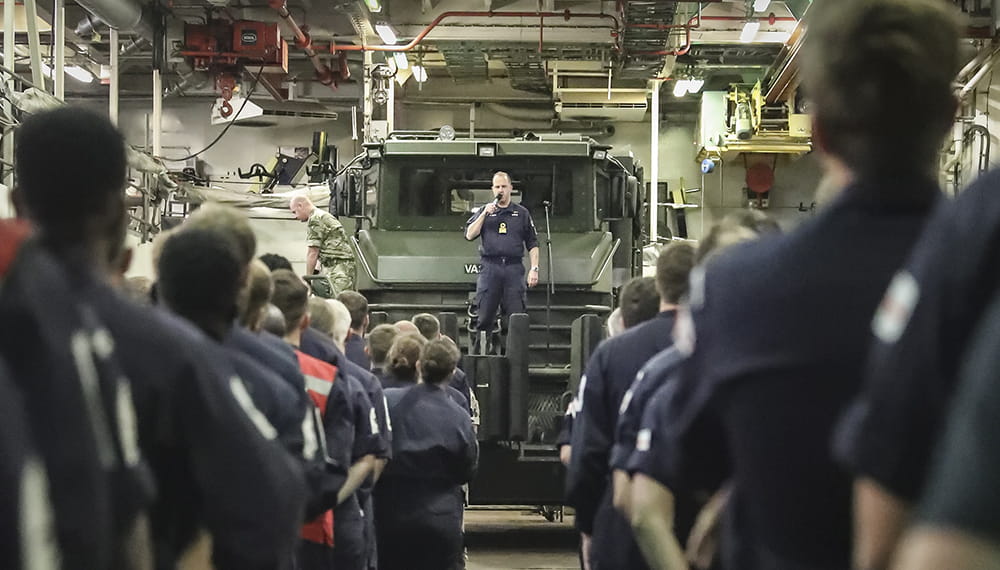 royal navy commodore addresses ship's Company on board