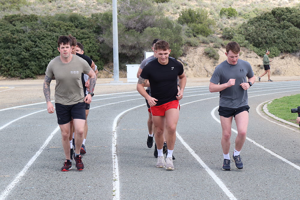 Group of people running preparing for their Royal Navy test. Life in the Royal Navy is wide-ranging and incredibly varied, and therefore requires a good level of physical fitness. 