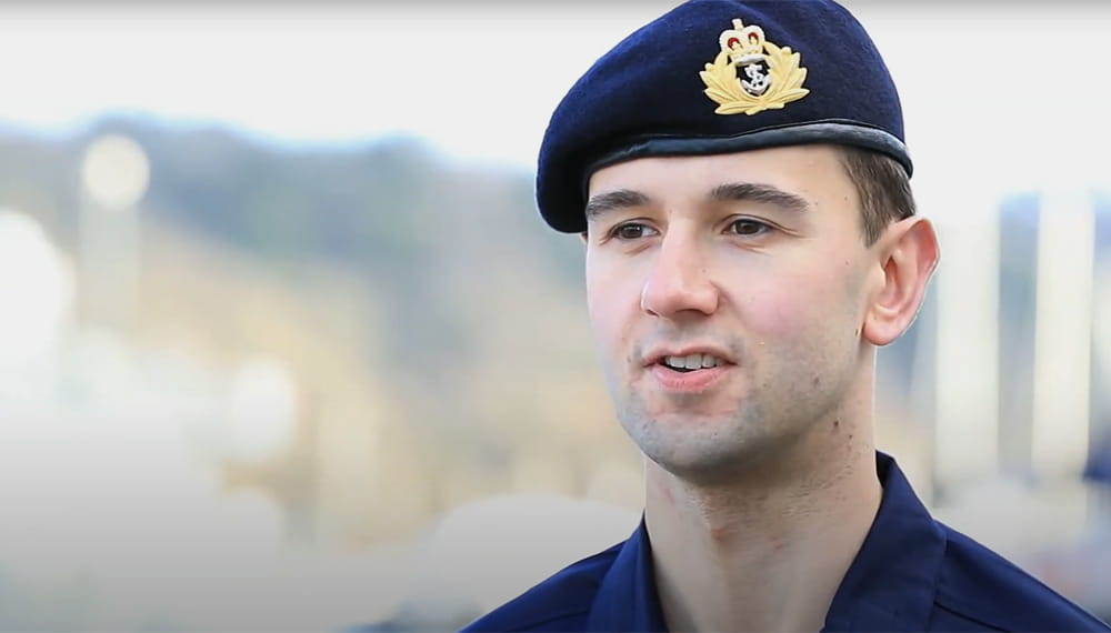 Portrait of a Royal Navy Reservist wearing blue beret during a video interview