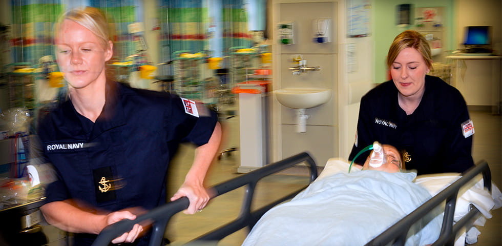 Operating Department Practitioners walking a patient in a stretcher