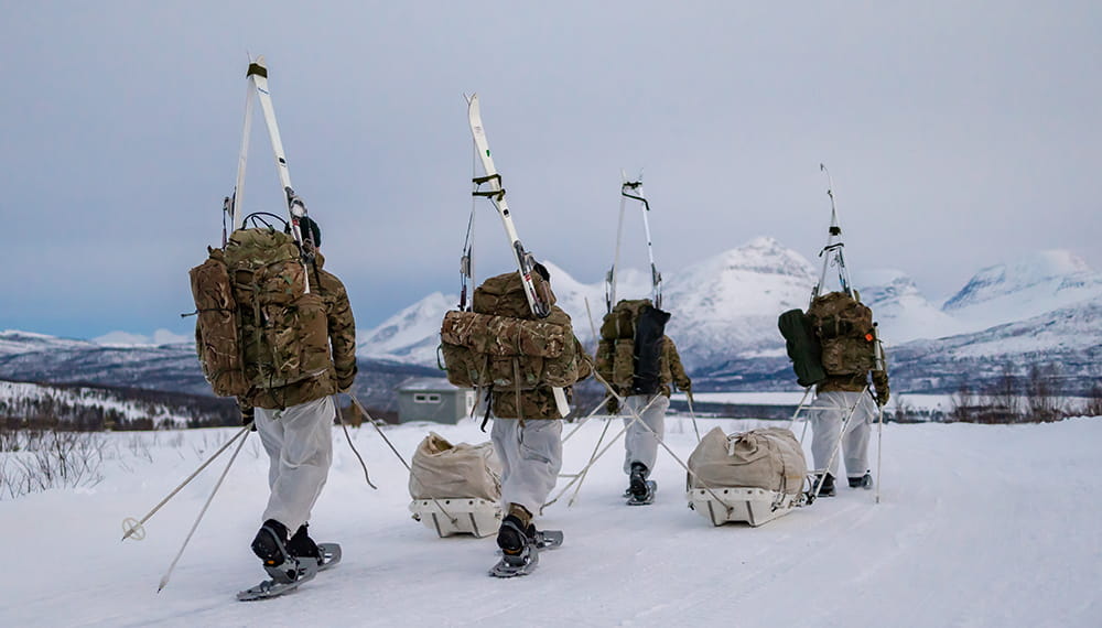 Royal marines winter deployment. Commando forces yomping on snow shoes and carrying their skis during their Cold Weather Winter Warfare Course near Skjold. 