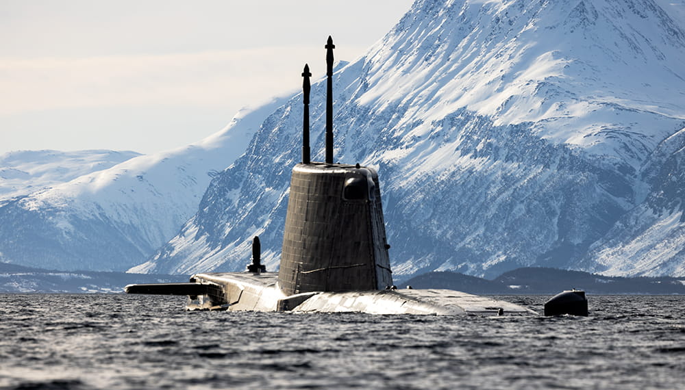 Submarine at Lyngan Fjord in Northern Norway. Royal Marines carrying out their traditional winter deployment in the Arctic Circle.