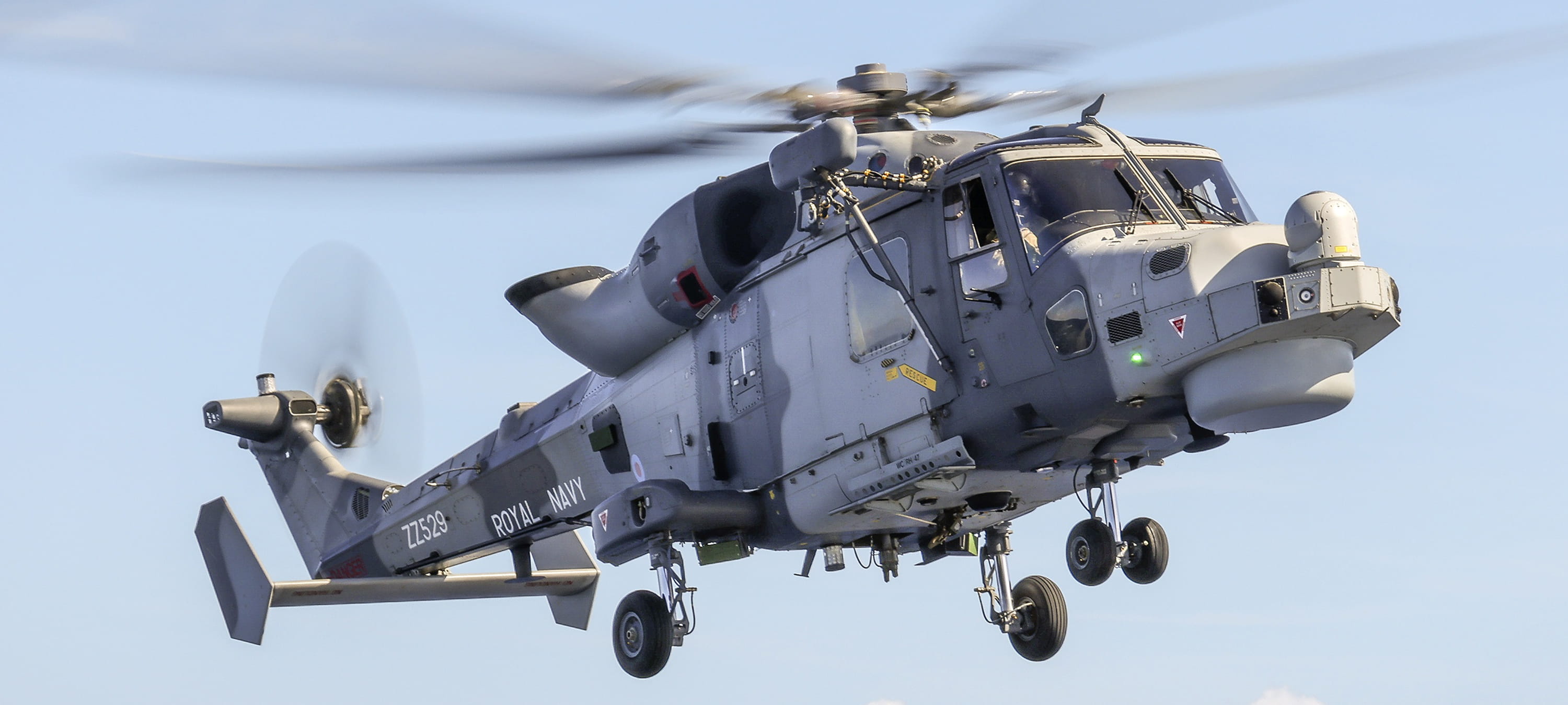 A Royal Navy Wildcat helicopter in flight