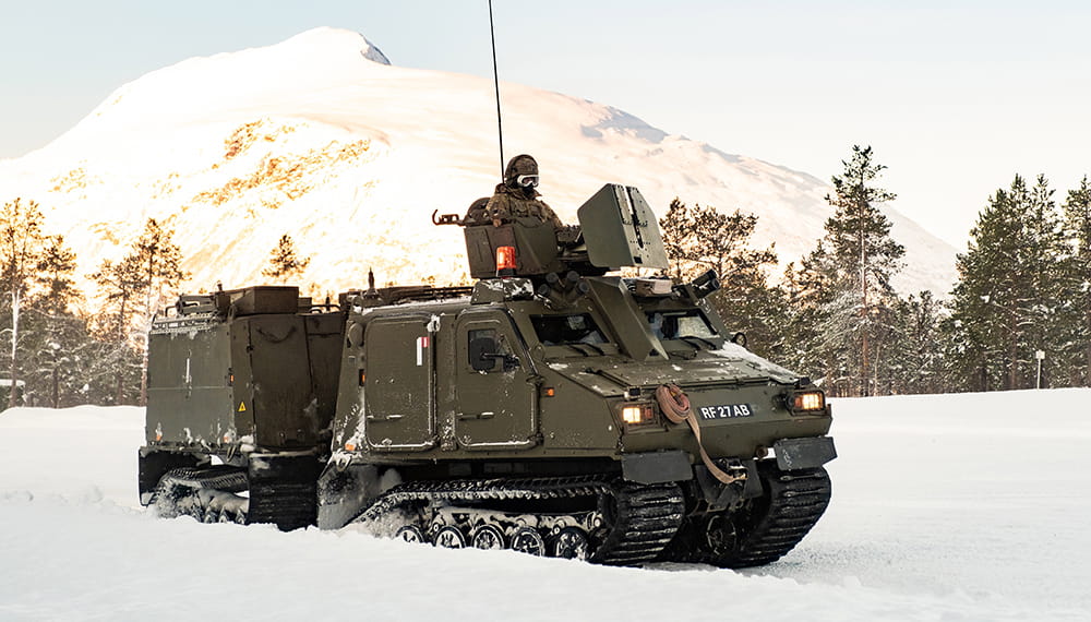 Royal Marines conducting snow and ice driver training with Vikings