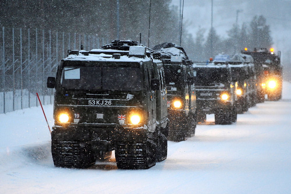 A convoy of BVs driving through snow