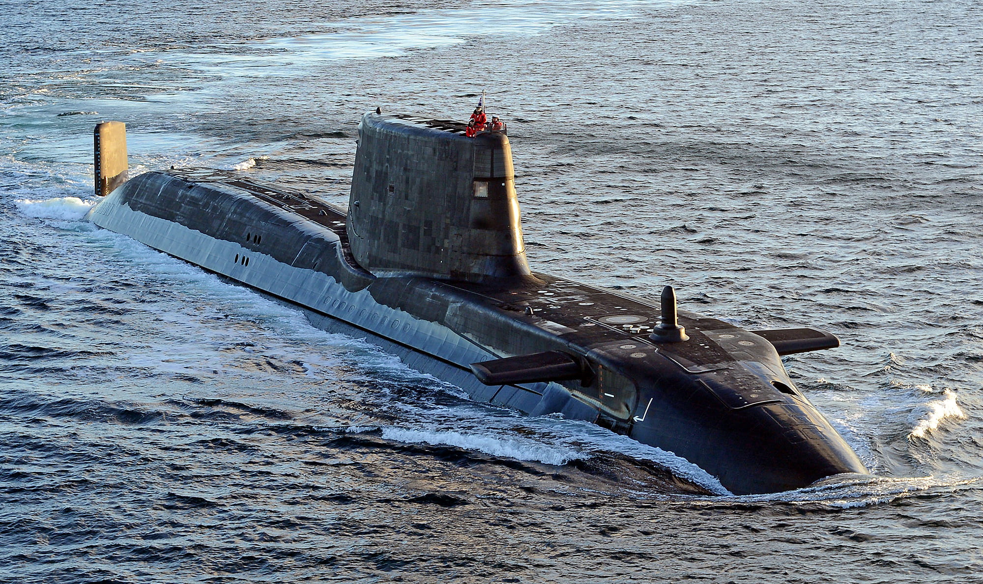 HMS Astute submarine surfaced surrounded by water