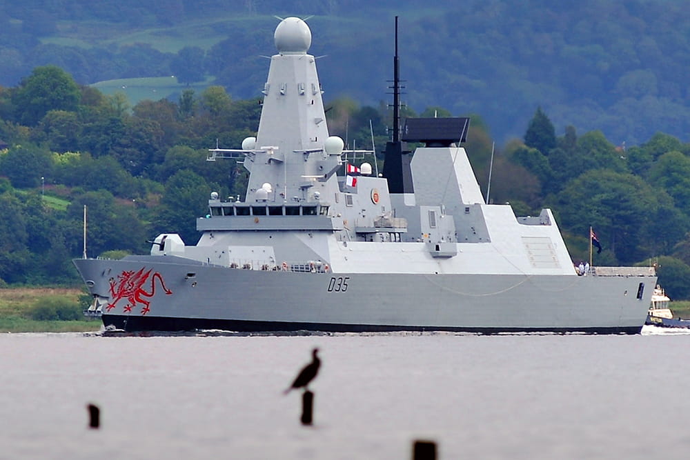 HMS Daring powers down the River Clyde