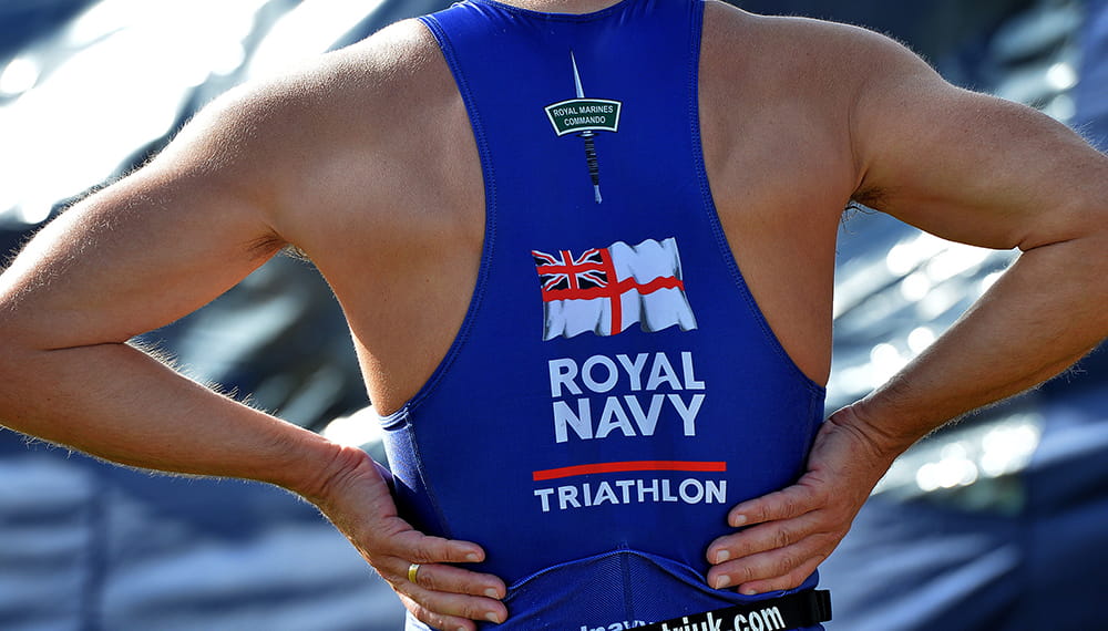 The back of a Royal Navy triathlete with hands on their hips