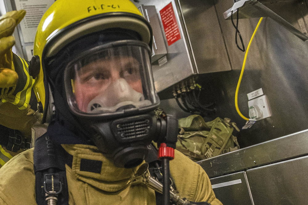 HMS Kent's ship's company take part in a galley fire exercise whilst on maritime security operations around the Uk