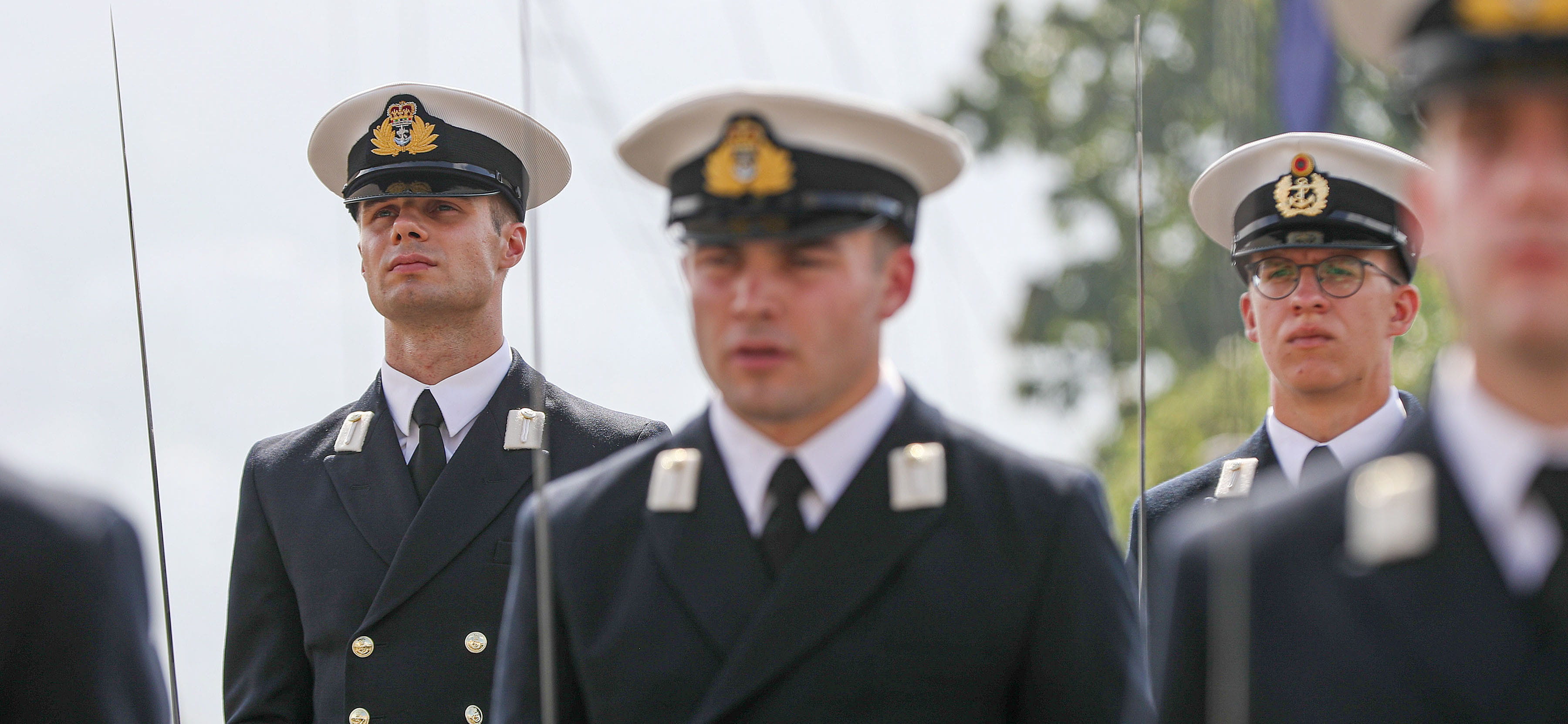 ROYAL NAVY OFFICERS AND RATINGS STAND READY TO SERVE