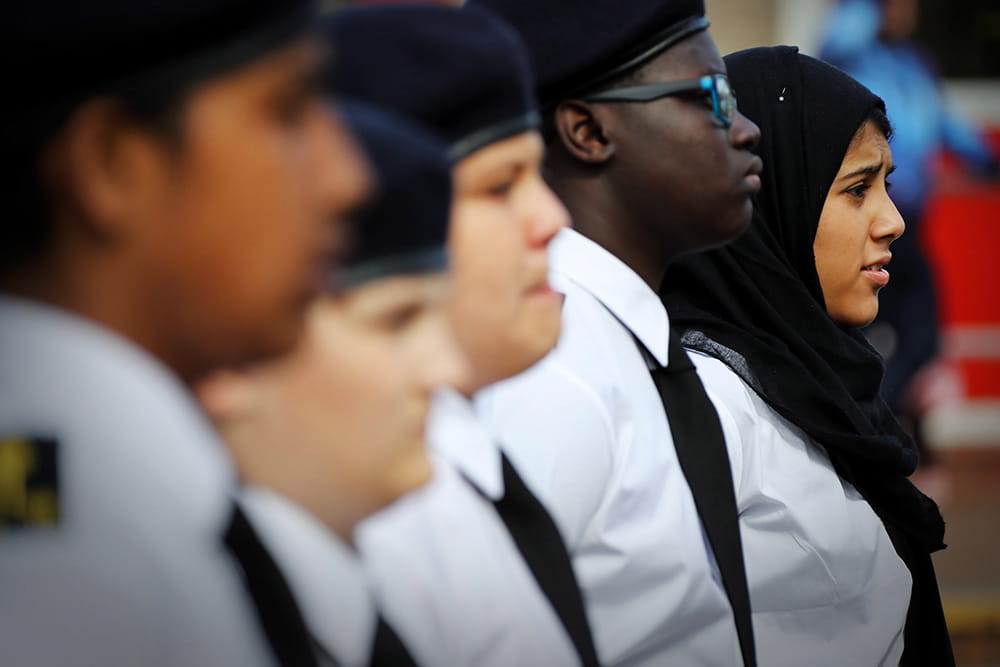 Heads and shoulders of a row of Royal Navy cadets standing in line